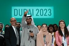 Sultan al-Jaber, the president of the COP28 summit in Dubai last year, center, with other officials. The Dubai summit yielded a resolution that for the first time called for decarbonizing the world’s energy system.